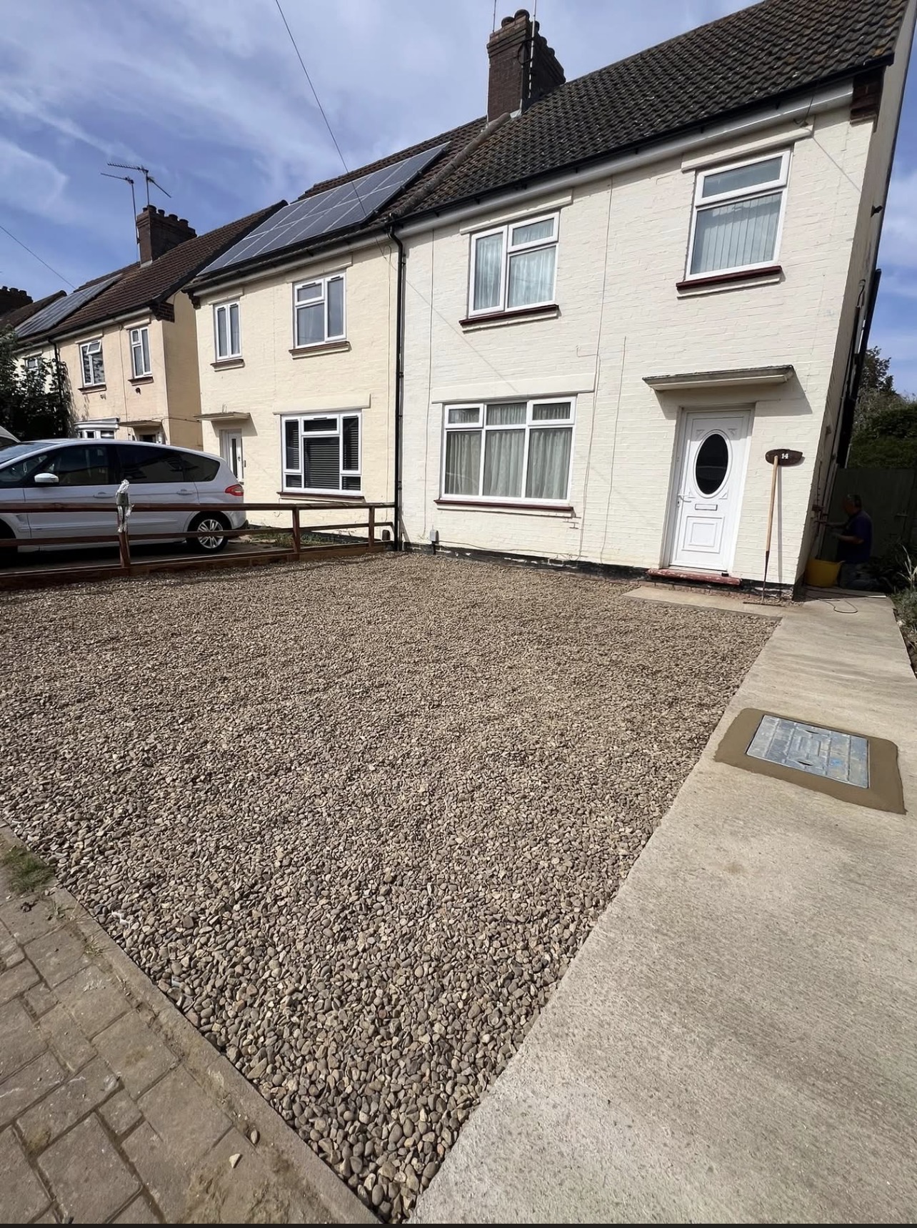 Front drive — fresh gravel finish
